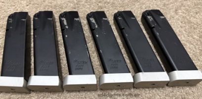 Six Sig Sauer X5 all-round Magazines spaced to 10-round capacity in used condition, all fully operational